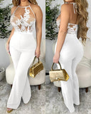 ELEGANCE IN CONTRAST HALTER JUMPSUIT - B ANN'S BOUTIQUE, LLC